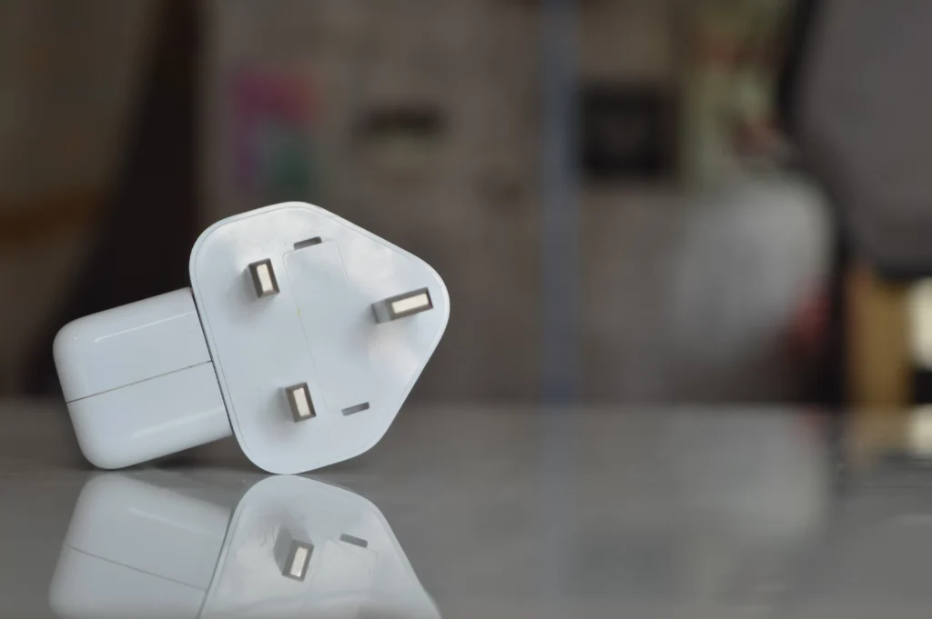 front view of white smart plug with blurred background scaled