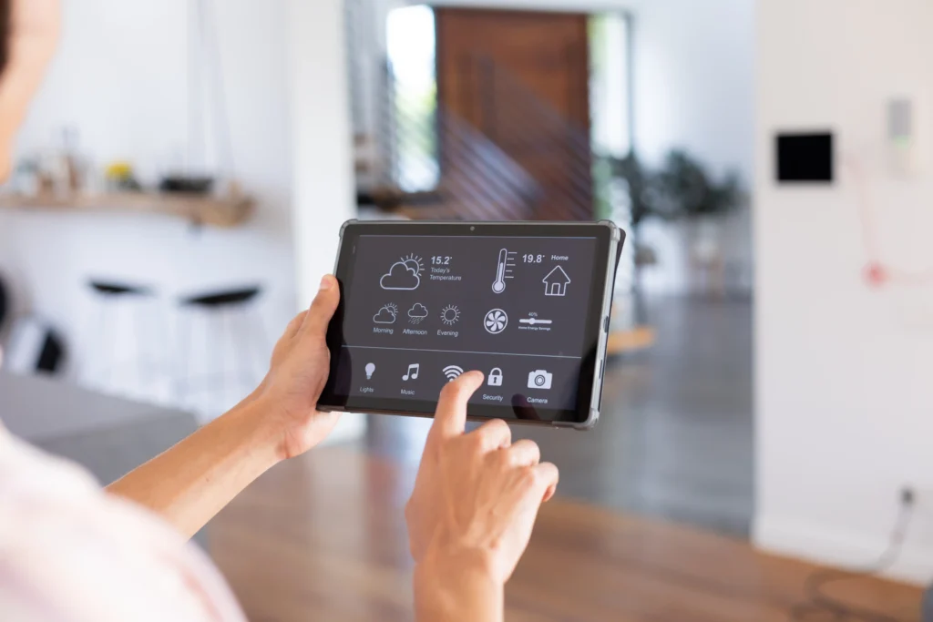 Man using tablet to control home
