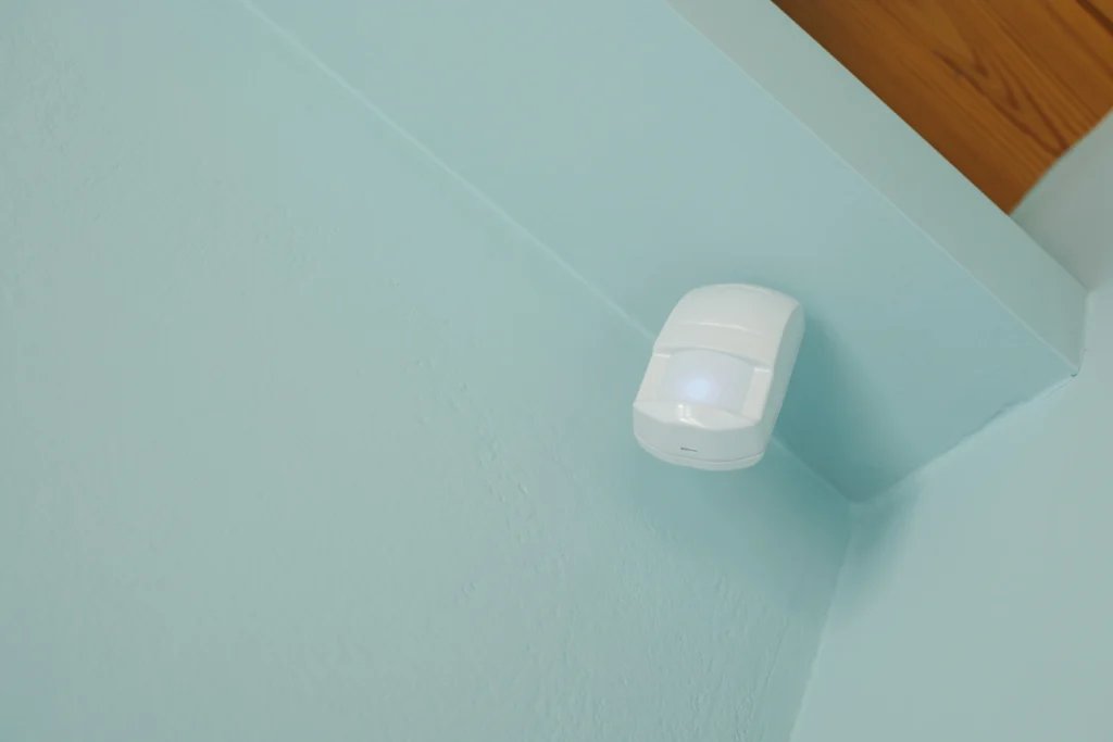 indoor security motion sensor mounted on wall
